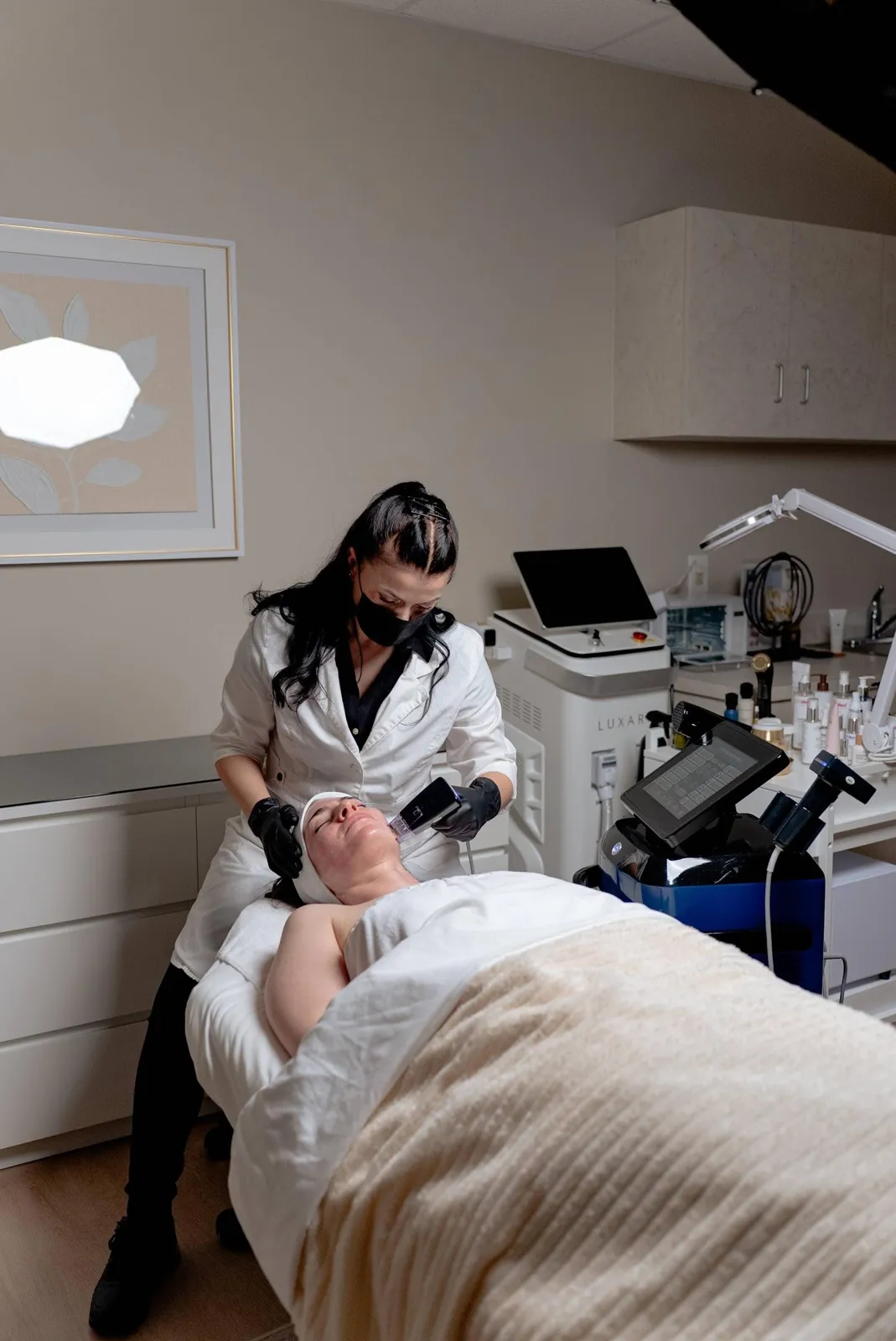 A Nuvera provider performing a skin treatment